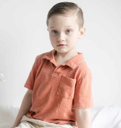 Child smiling outside