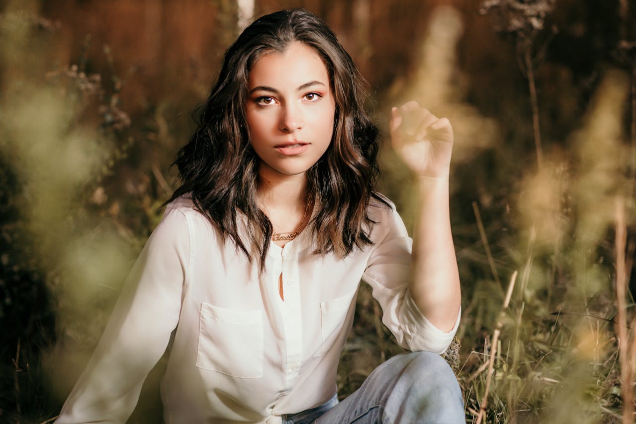 Senior portrait against blue wall